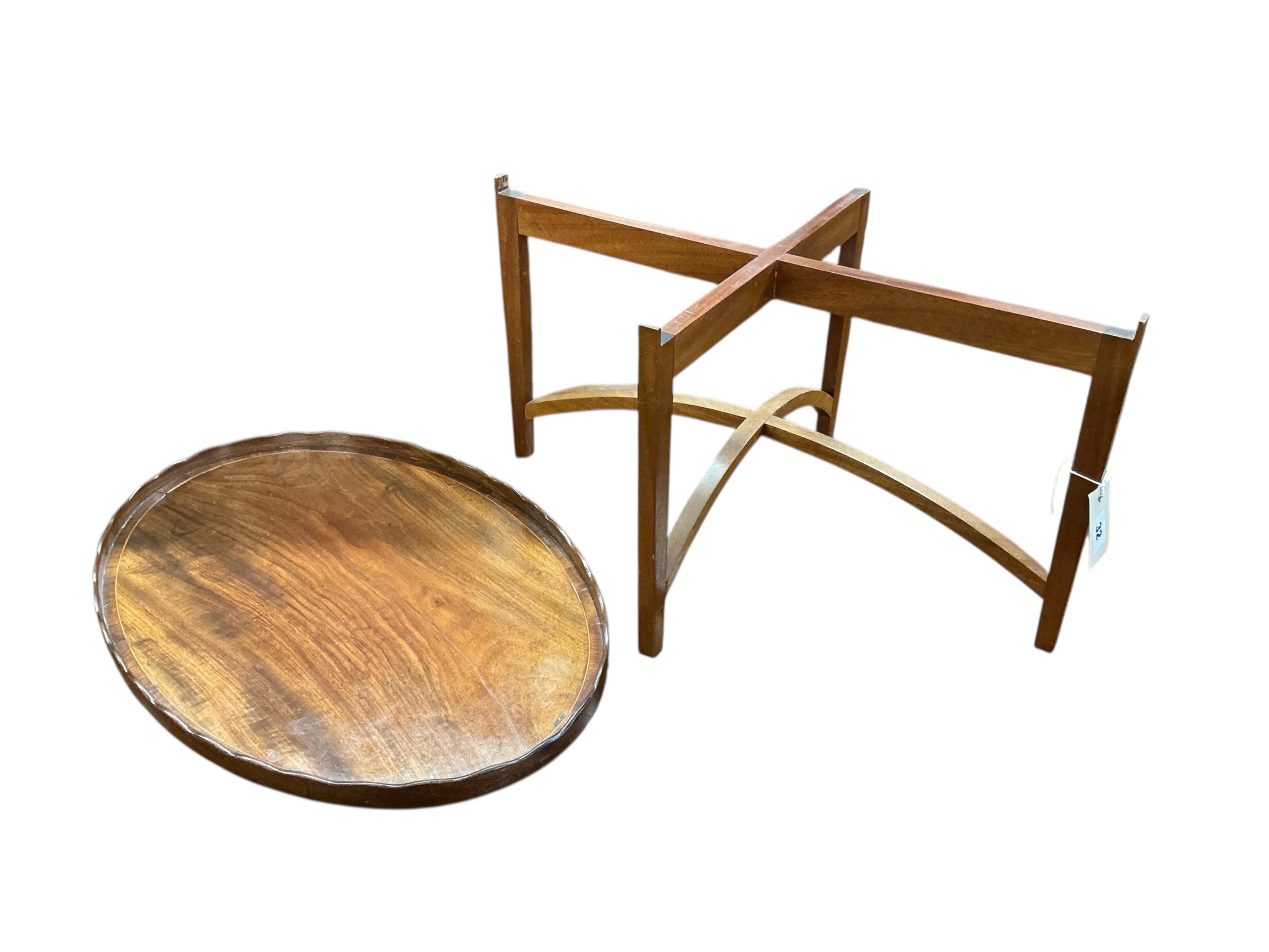 A George III oval mahogany tea tray on later stand, width 58cm, depth 39cm, height 33cm